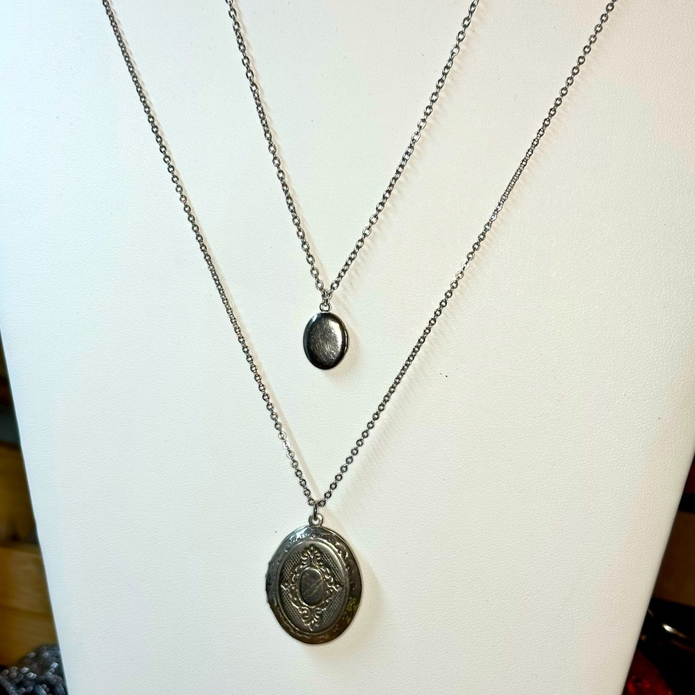 2 silver tone vintage lockets on chain- different sizes